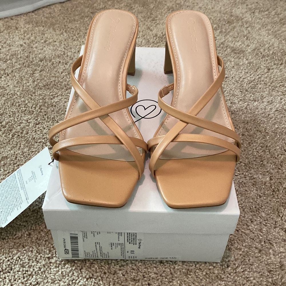 Brand new! Squared open toe and squared heal sandal. Never worn.